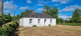 "Bel-Air", Laplands, Carr's Hill, Douglas, Cork T12EKW0     Superbly Located Three Bedroom Bungalow on C. 0.36 Acre with Development Potential & eligible for the Vacant Property Refurbishment Grant.